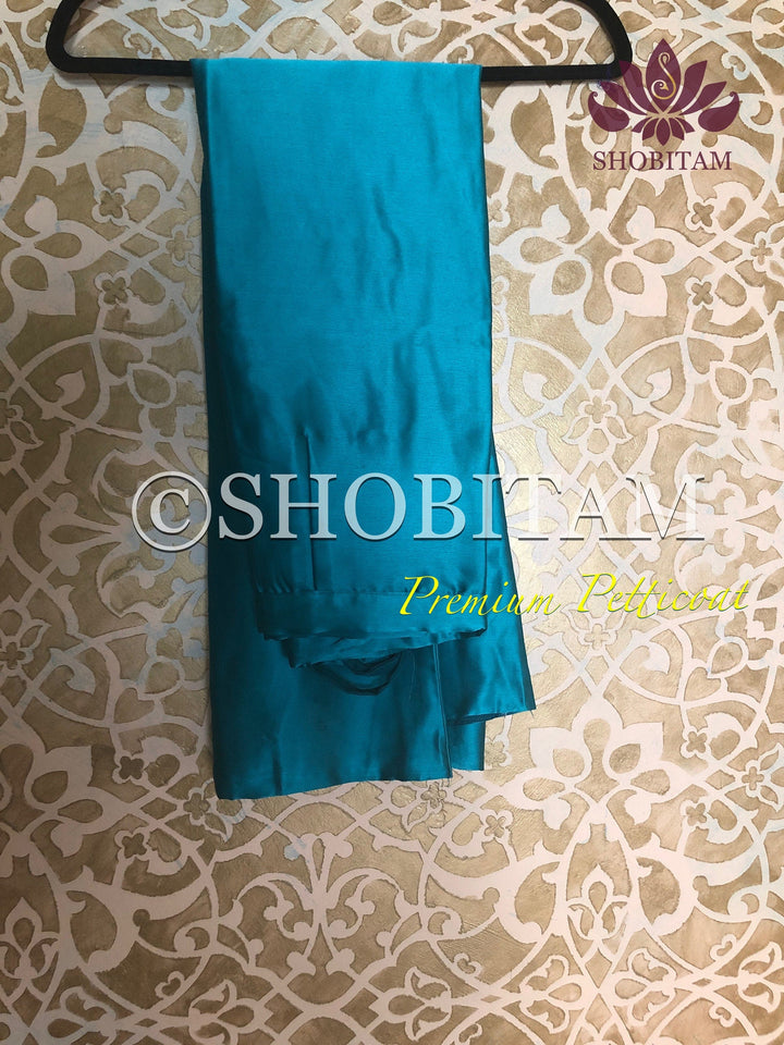 Premium Quality teal green Satin Petticoat for saree, in standard size. | SHOBITAM