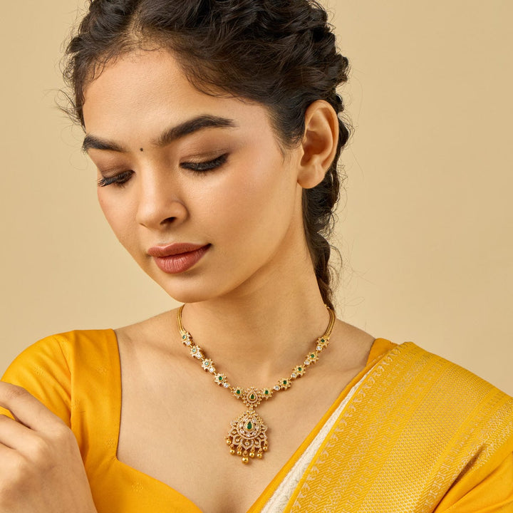 Pure 92.5 Silver, Gold Plated Floral Motif Temple Necklace with Pear-Cut Emerald Pendant with Gold Dangling Beads
