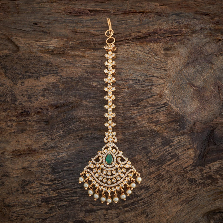 Traditional Design Tikka with shimmering white Green stones and beads finished in luxurious gold polish