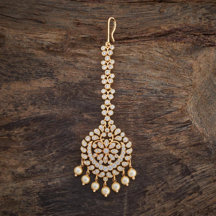 Traditional Design Tikka with shimmering white stones and beads finished in luxurious gold polish