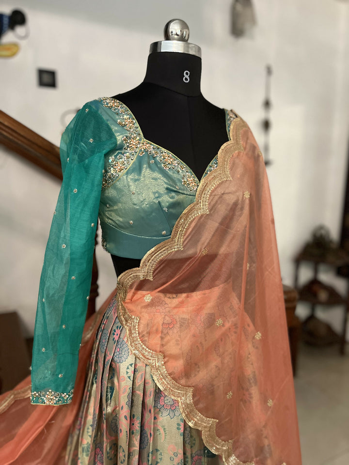 Yuvathi Tissue Pastel Peach half saree/lehenga set